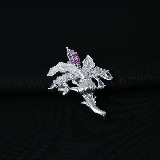 Charming silver saree pin featuring a flower design and purple stones
