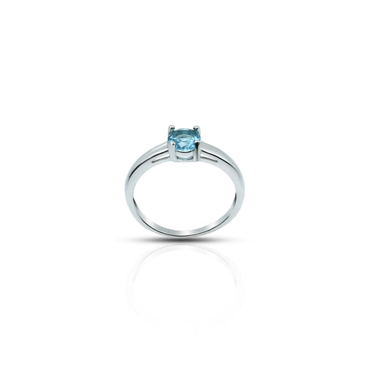 Elegant sterling silver ring featuring blue topaz gemstone.