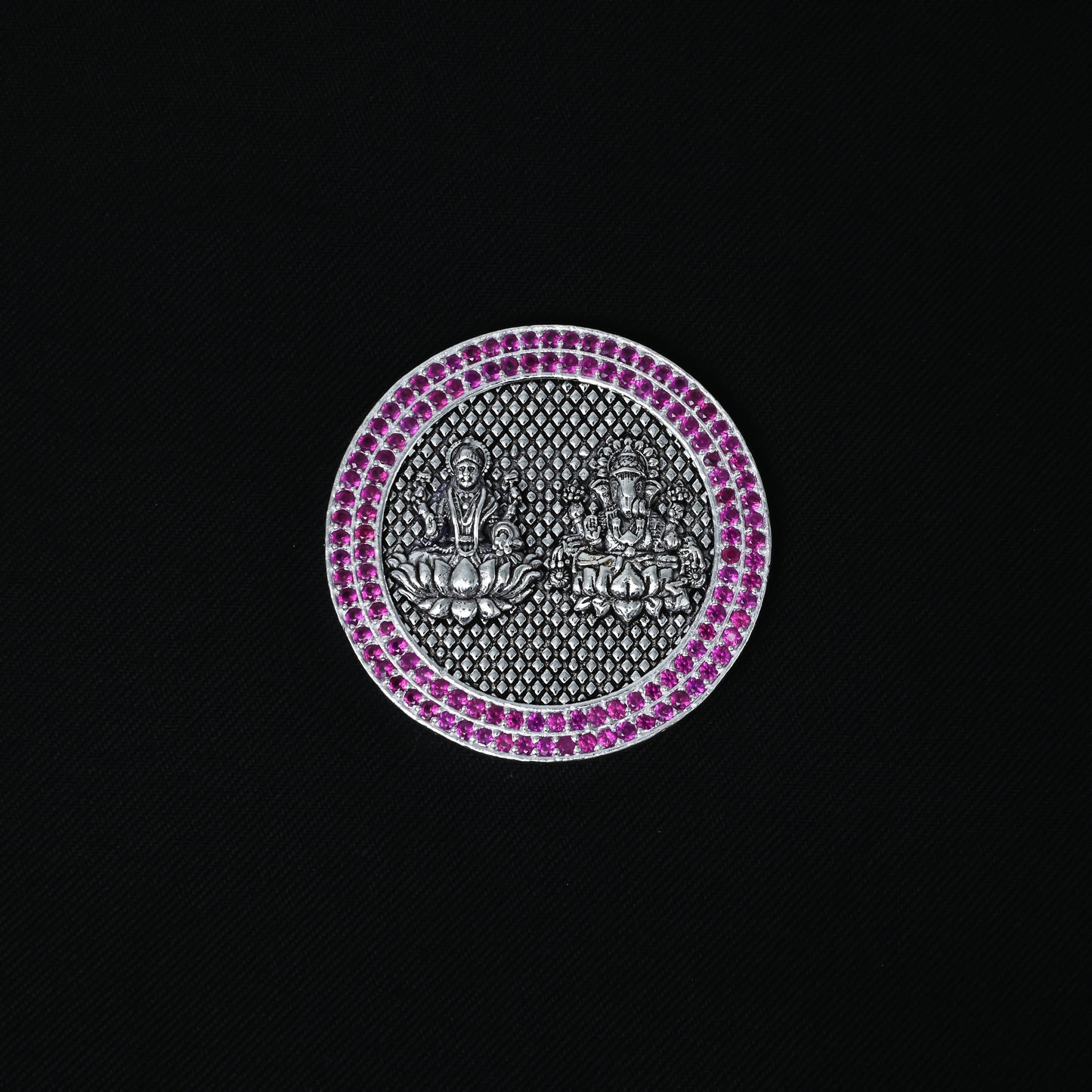 Elegant silver coin depicting Lakshmi and Ganesha with a purple stone edge