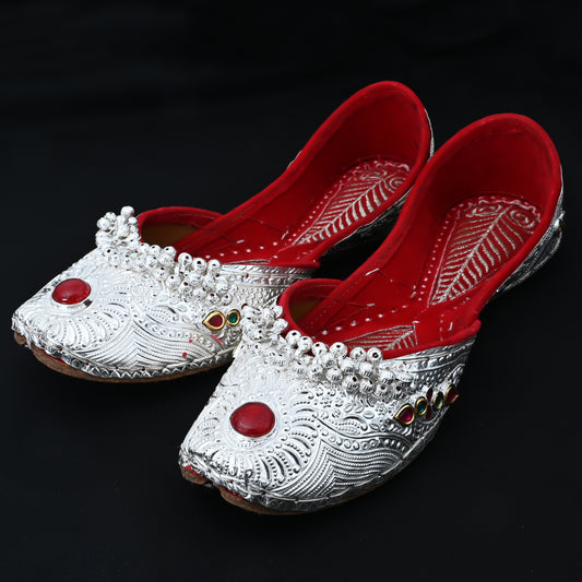 Elegant handcrafted silver jutti with red gemstone accent for women