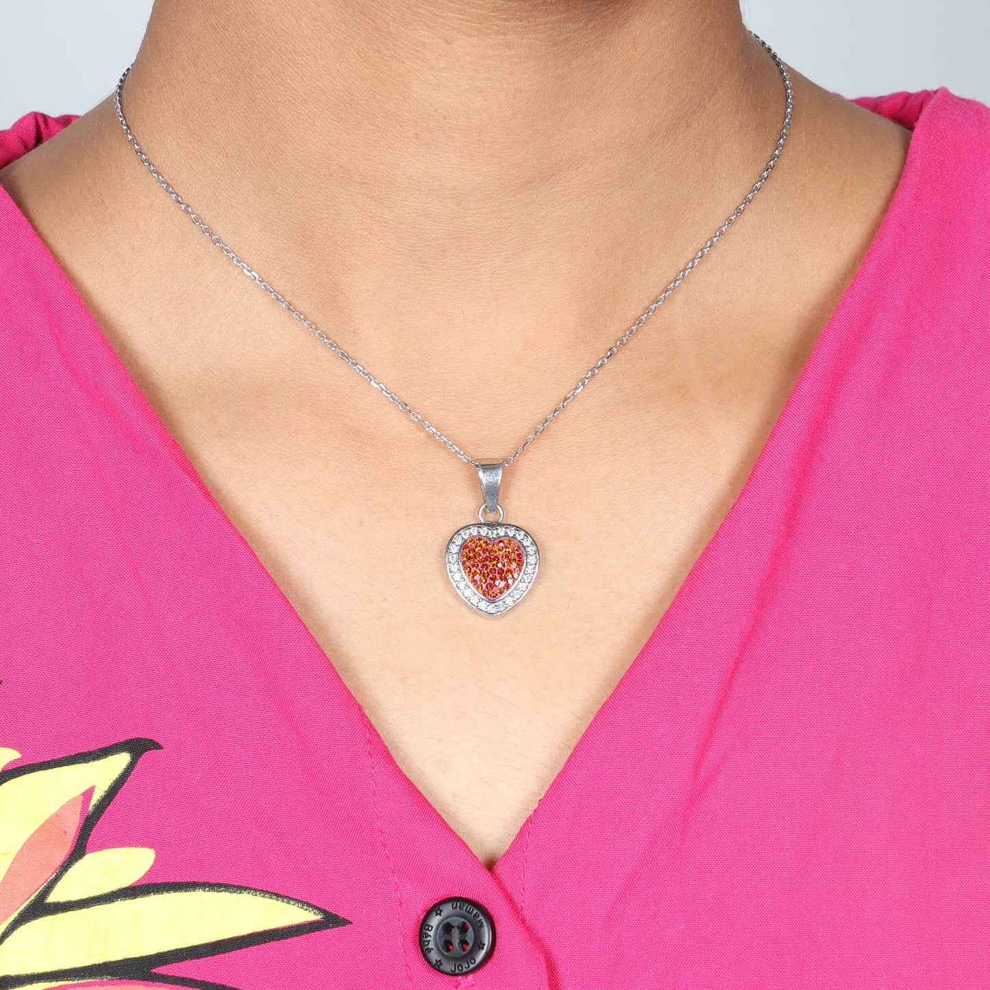Red heart pendant with multiple stones on a delicate chain