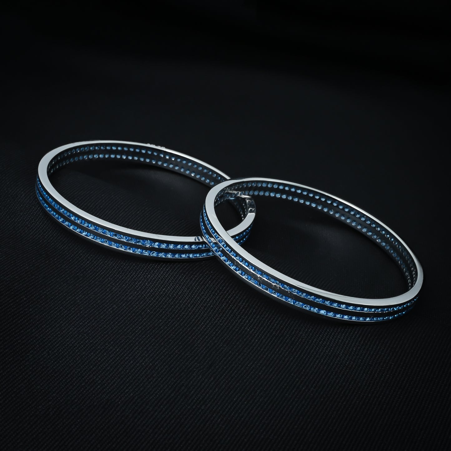Elegant silver bangles with blue stones