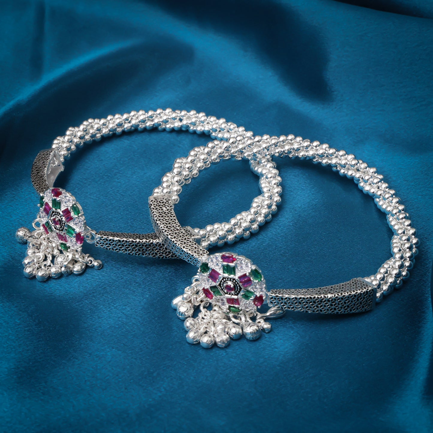 Elegant silver payal with multicolor stones, adding a touch of vibrancy.