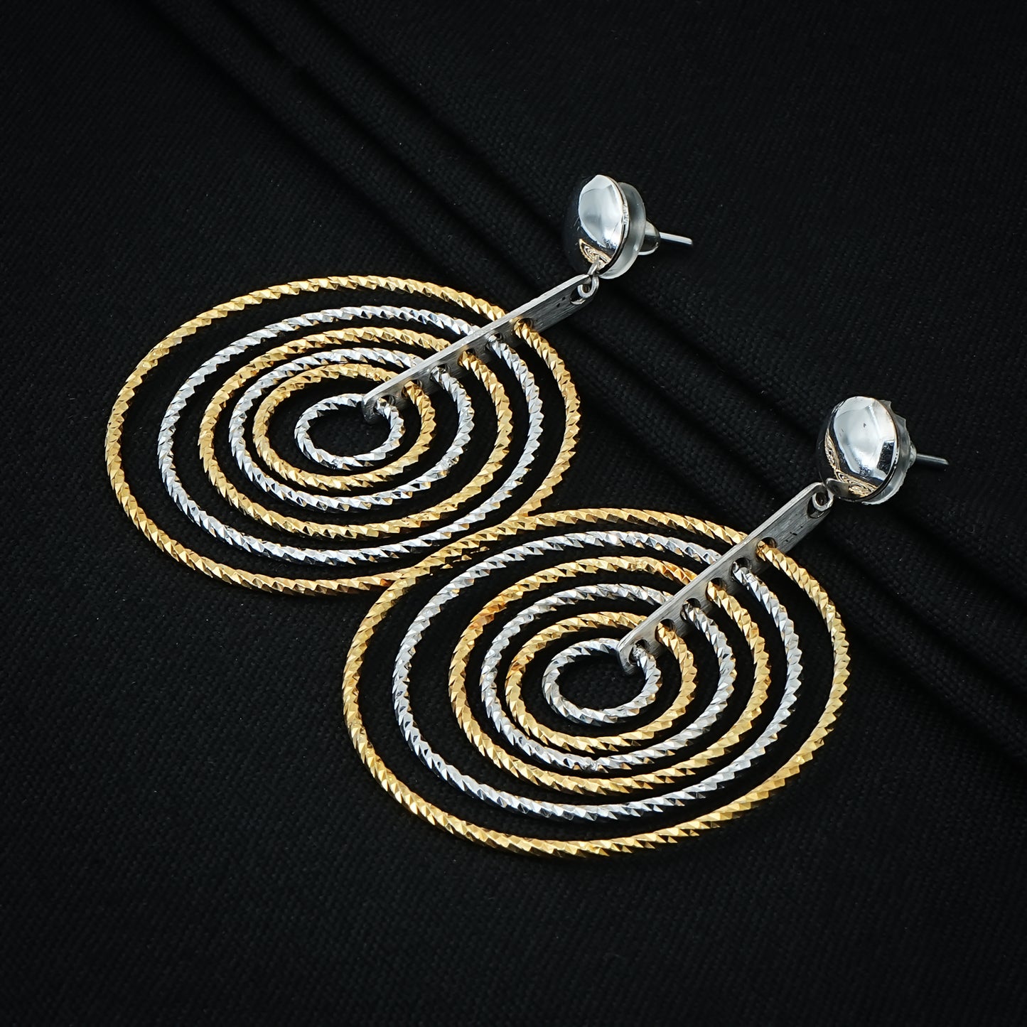 Chic dual-tone spiral earrings in silver for a sophisticated look