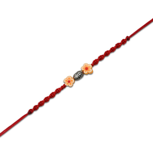 Boys' Rakhi with a sterling silver orange flower motif for a bright, colorful touch.