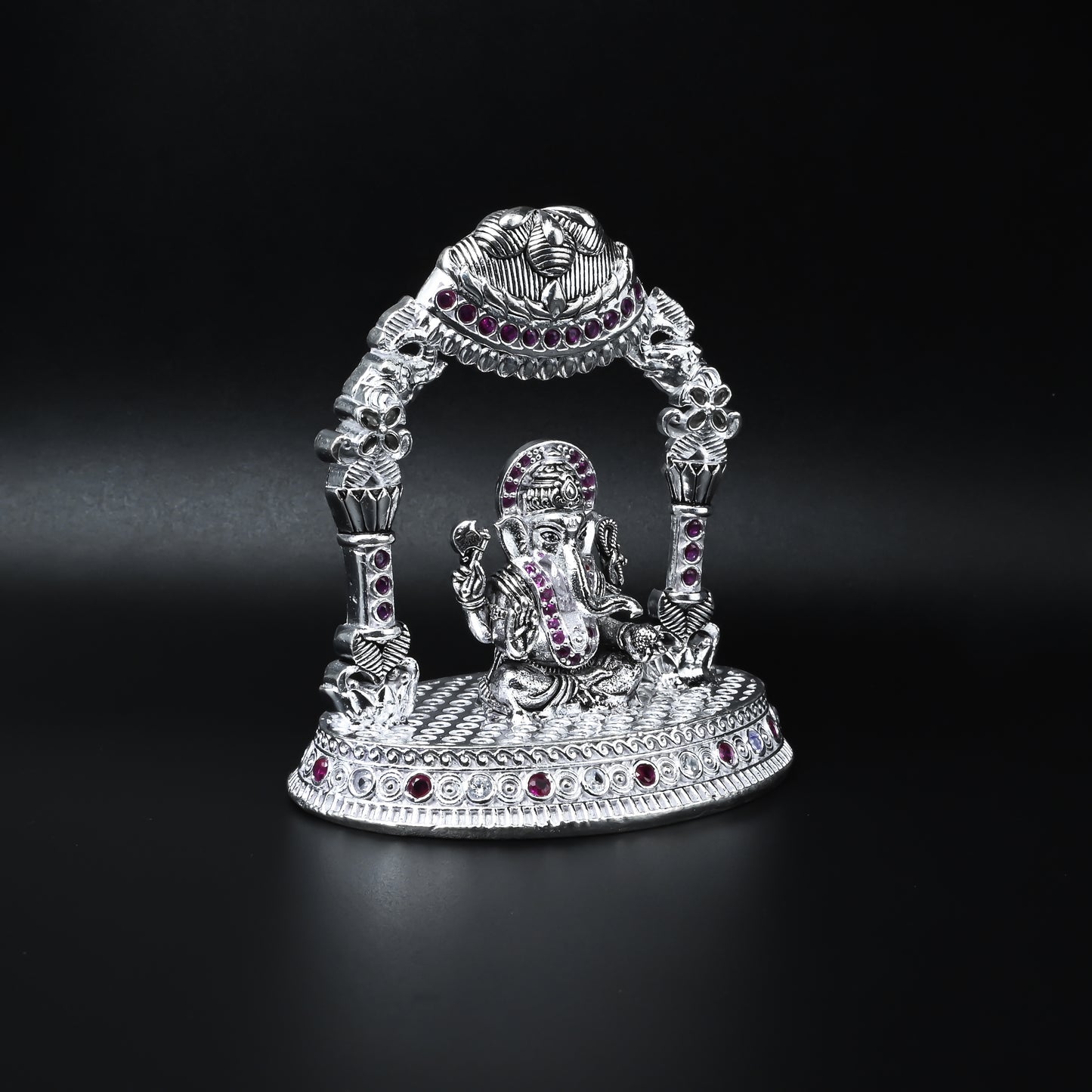 Elegant silver Ganesha murti with detailed multicolour stones