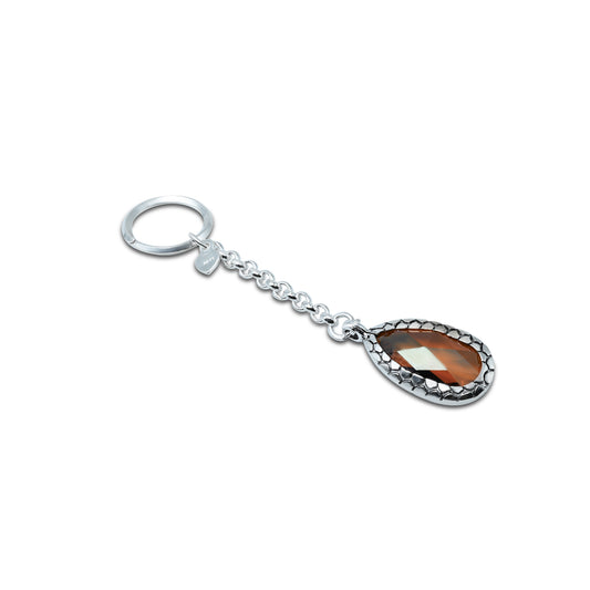 Elegant silver keychain adorned with a striking orange gemstone for a bold accessory