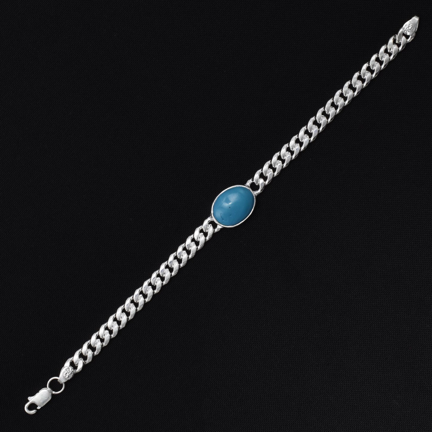 Stylish silver bracelet with a vibrant blue gemstone, perfect for boys