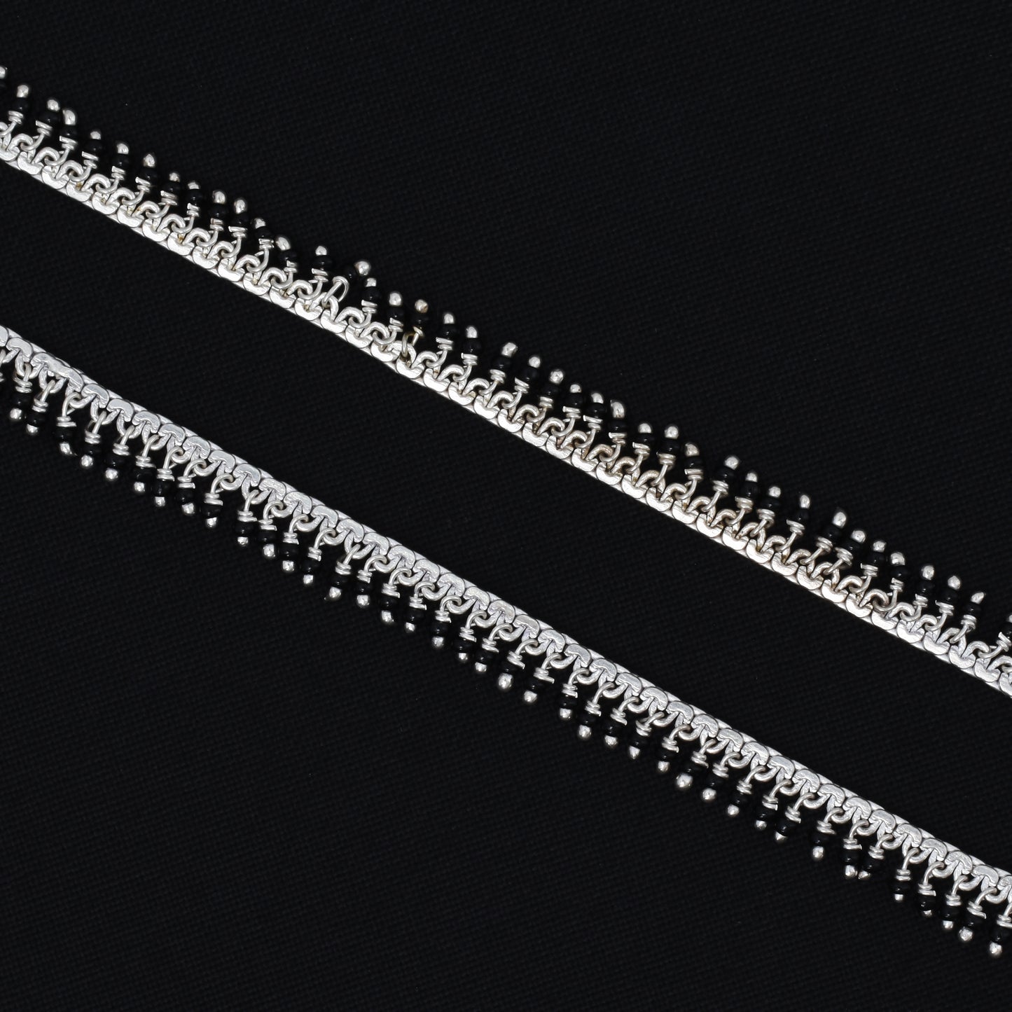 Timeless silver payal with black beads, adding a touch of elegance to any outfit
