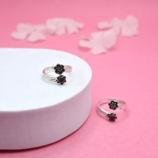 Elegant Silver Toe Ring with Floral Accent red stone