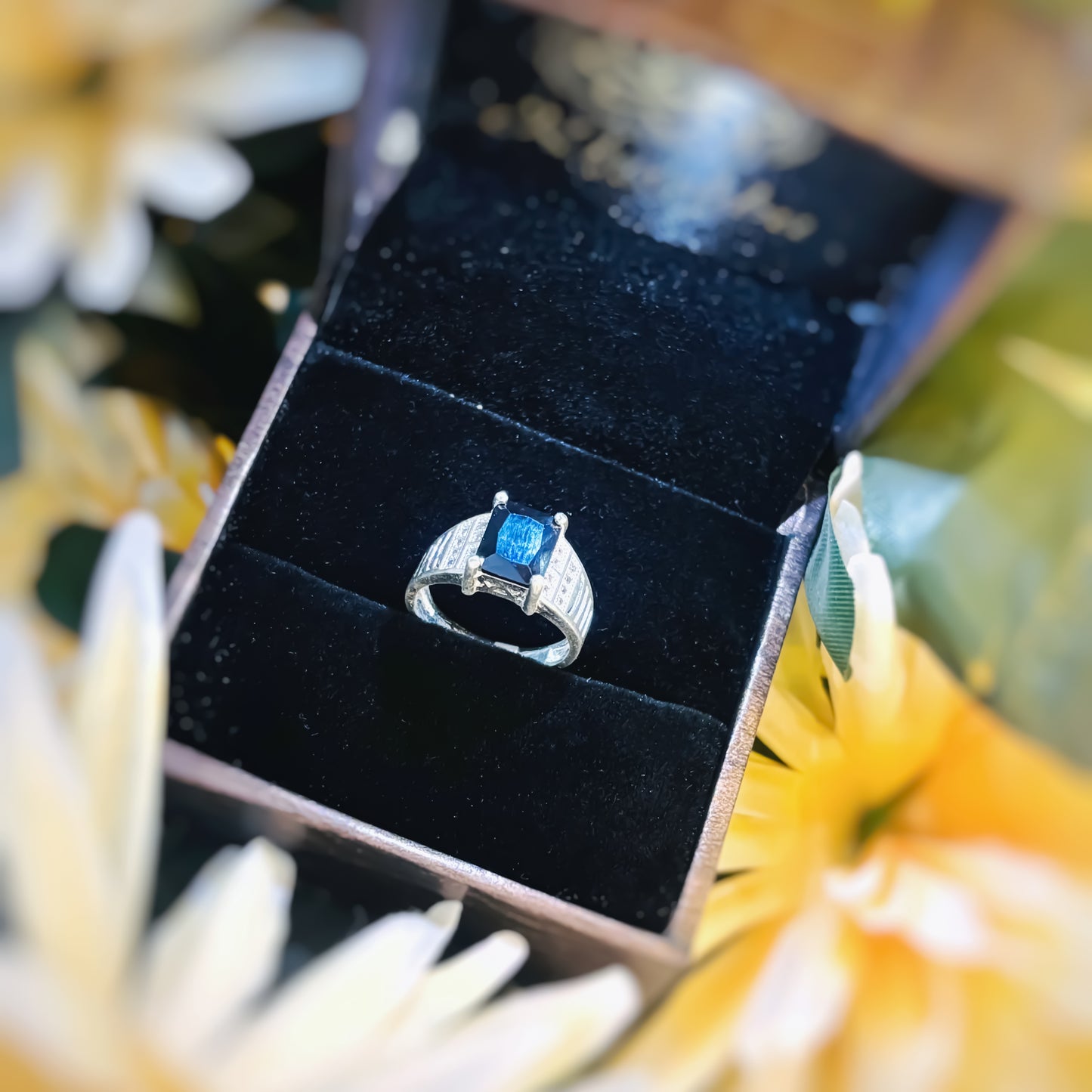 Sleek silver ring for men featuring a bold blue stone.