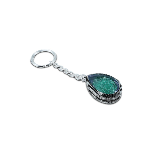Stylish silver keychain with a teardrop-shaped green gemstone for a chic look