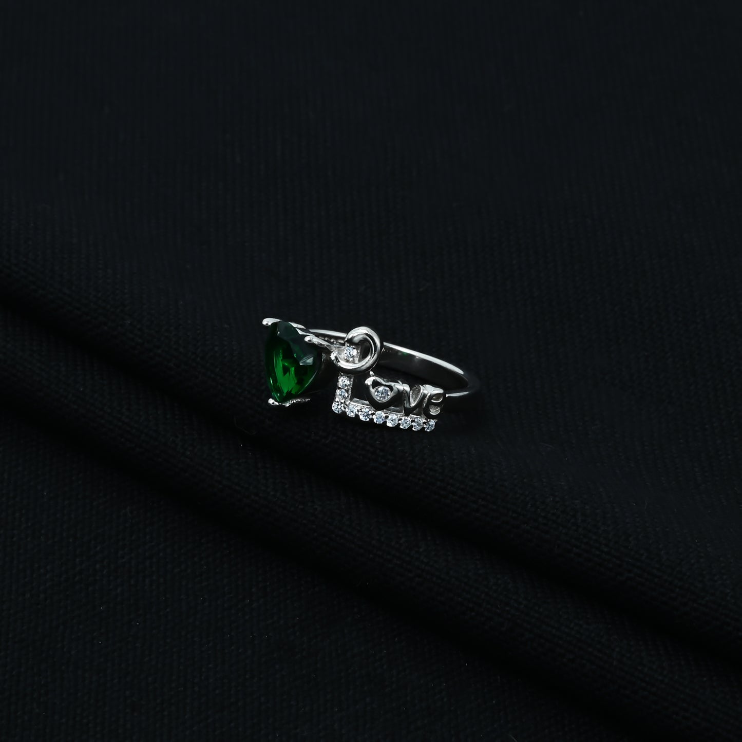 Elegant silver ring featuring a heart-shaped emerald, perfect for a romantic gift