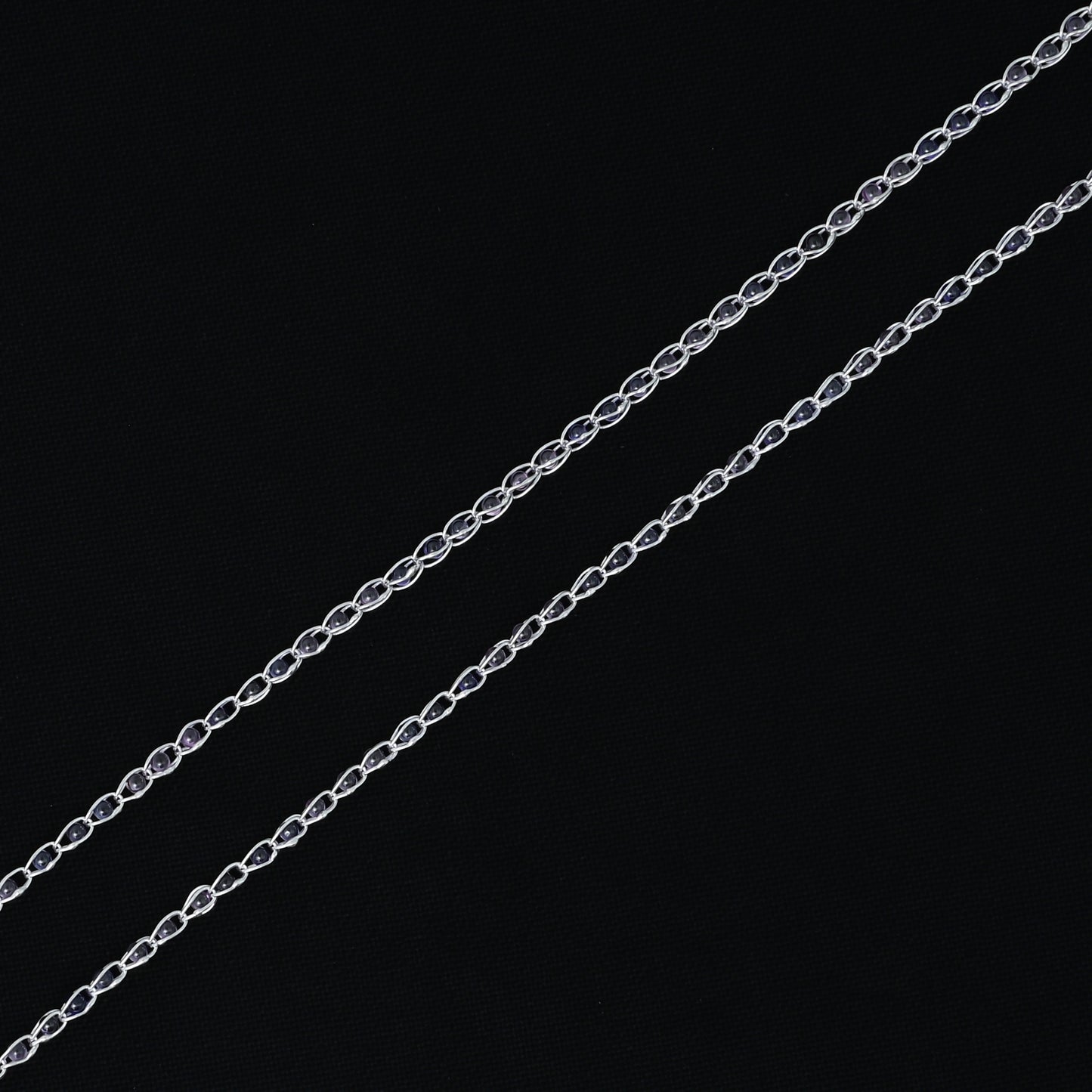 Girls' silver payal adorned with sturdy white and pink transparent beads, offering a graceful touch.