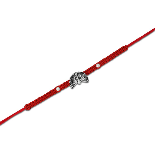 Boys' Rakhi featuring a silver peacock design with open feather details