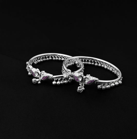 Silver payal featuring intricate peacock design and ghungroo bells