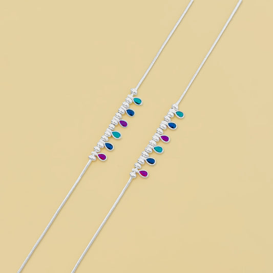 Elegant silver anklet featuring multi-color gemstones and silver ball accents.