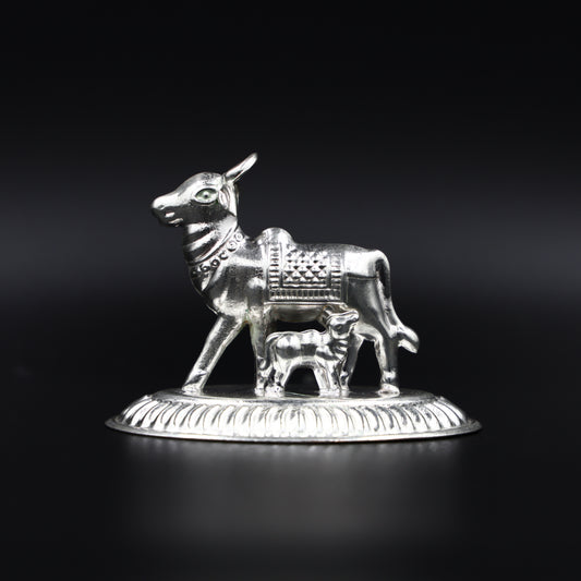 Handcrafted silver cow and calf statue, symbolizing divine blessings, ideal for worship and gifting.
