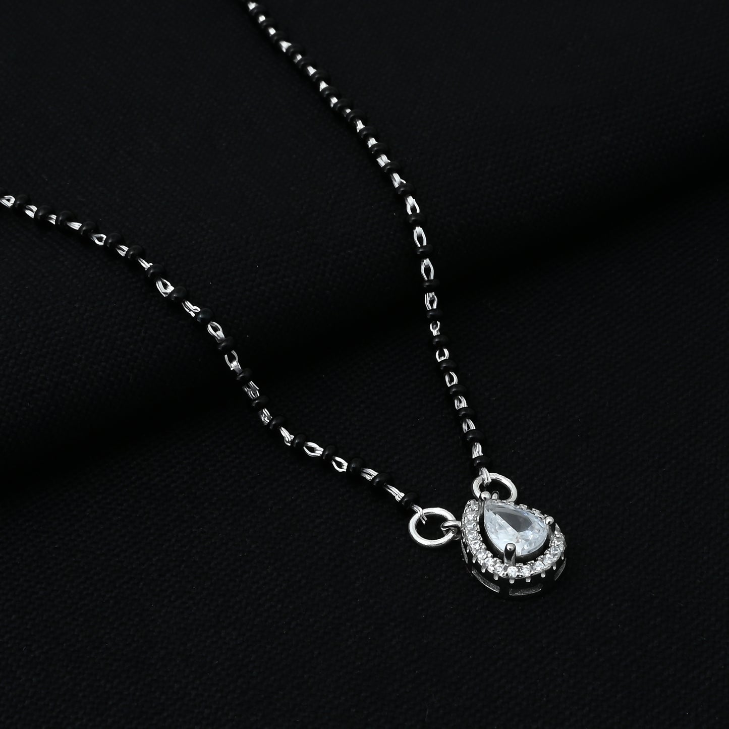 A Stunning White Gemstone Silver Mangalsutra Adorned with Black Beads