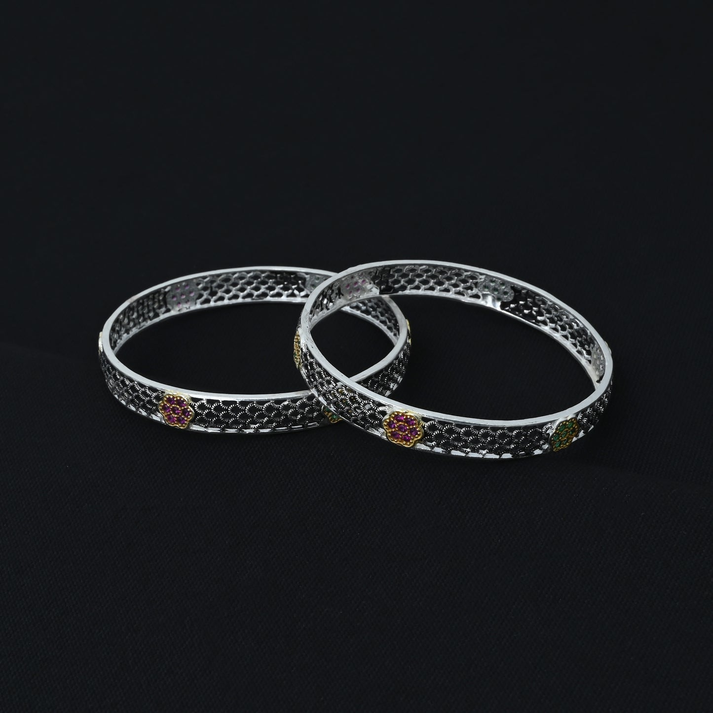 Elegant silver chudi with colorful gems and intricate wind and flower design, ideal for a fashionable and nature-inspired accessory