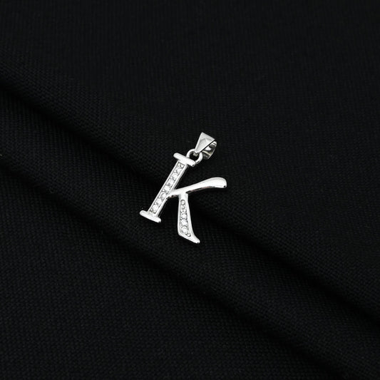 Sleek and modern silver pendant showcasing the letter 'K' in a unique design