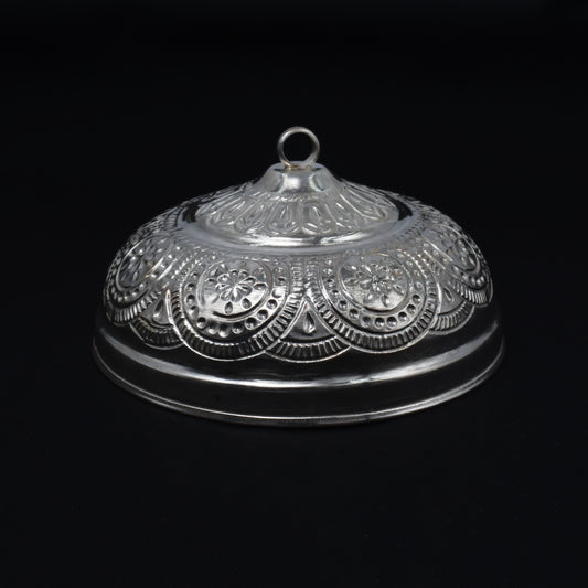 Close-up of the intricately designed silver chattar, featuring a hook for easy hanging during pooja.