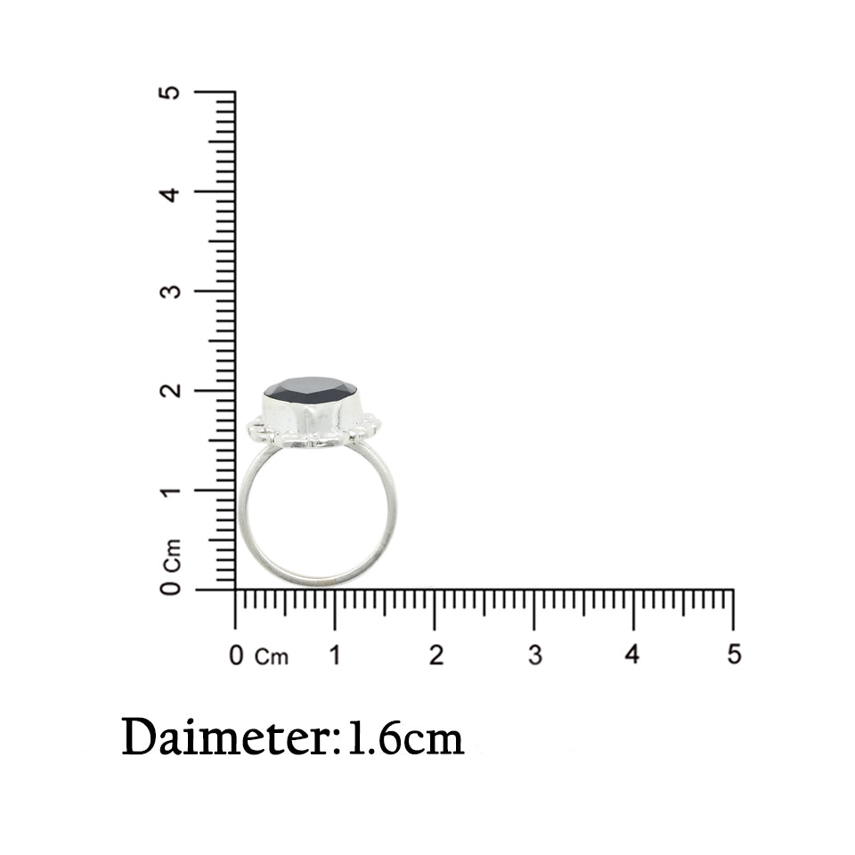 Silver ring with a shimmering midnight blue gemstone, adding a touch of mystery and elegance