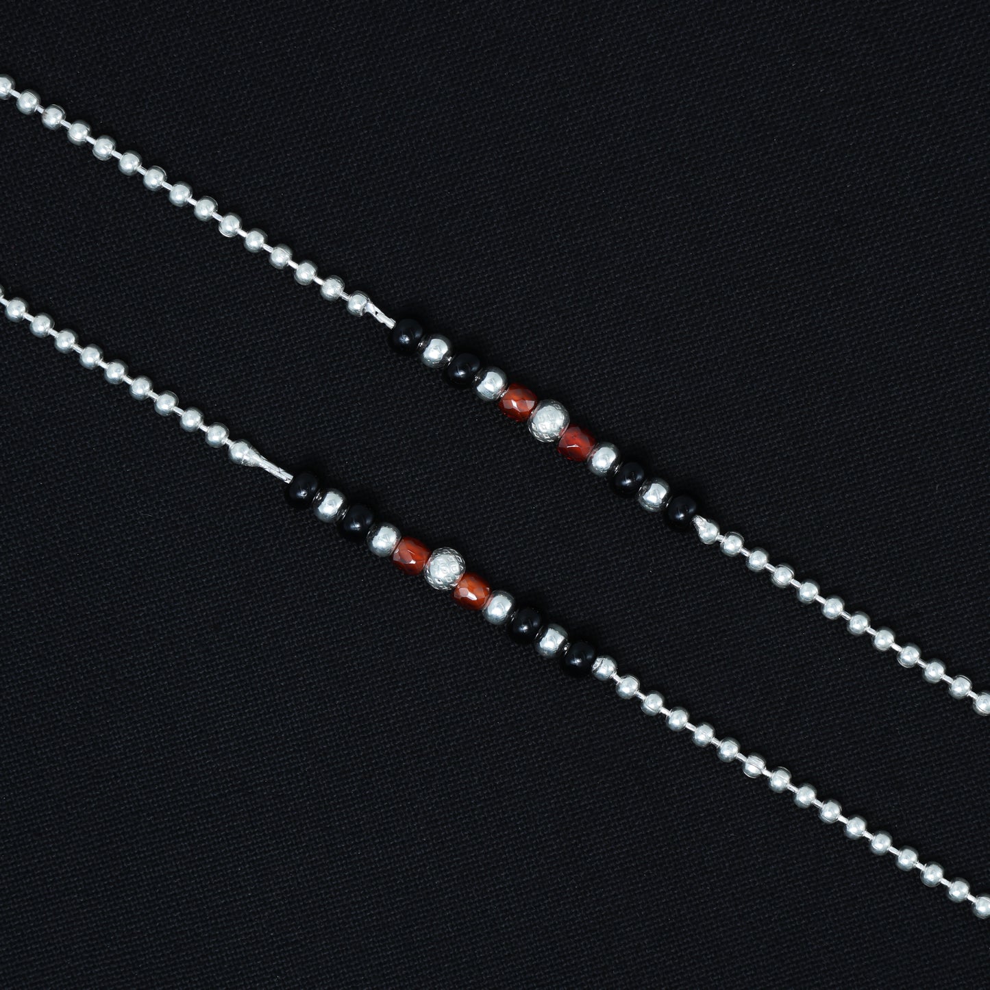 Silver anklet with sparkling beads in various colors, perfect for a playful and festive look