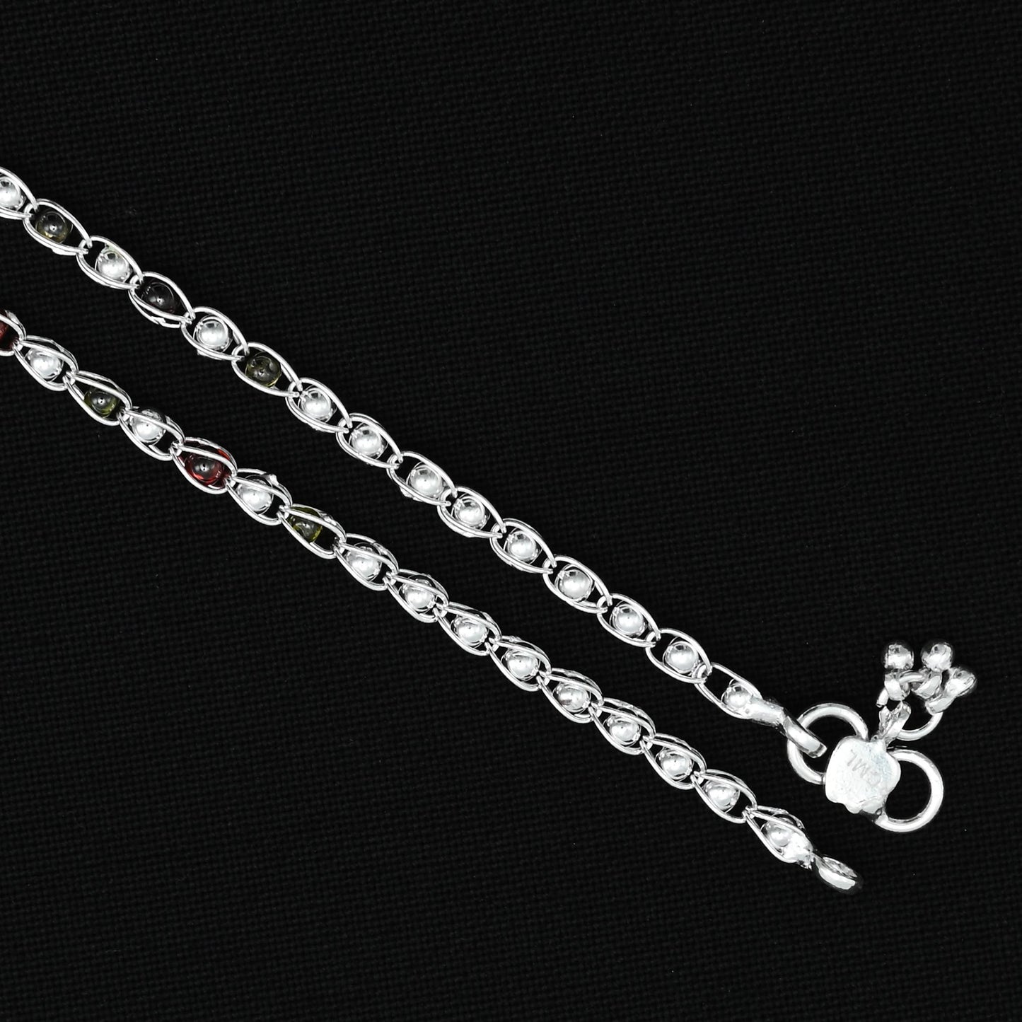 Charming silver anklet with a colourful gem sequence, perfect for adding a pop of color