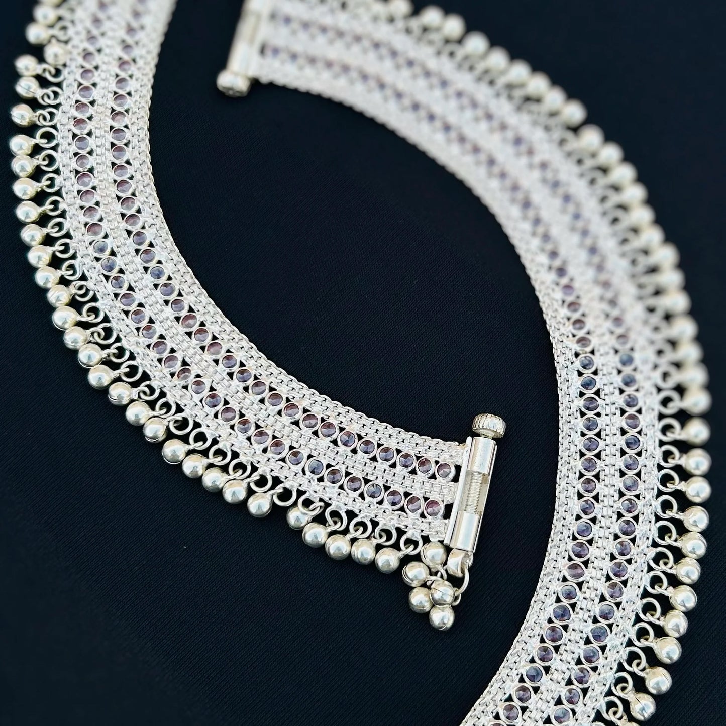 Timeless beauty silver payal with light purple stones and delicate ghungroos.