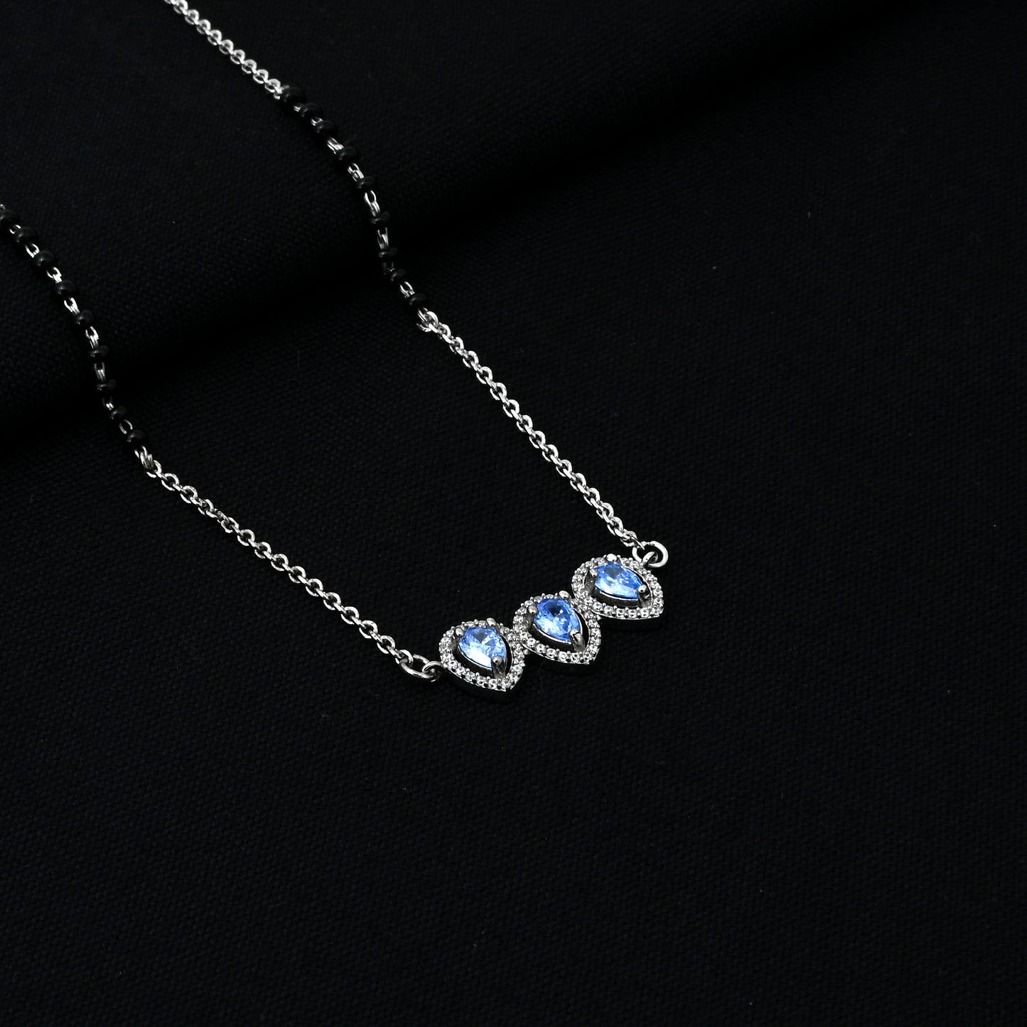 Timeless silver mangalsutra for women, adorned with a beautiful blue gemstone for added elegance