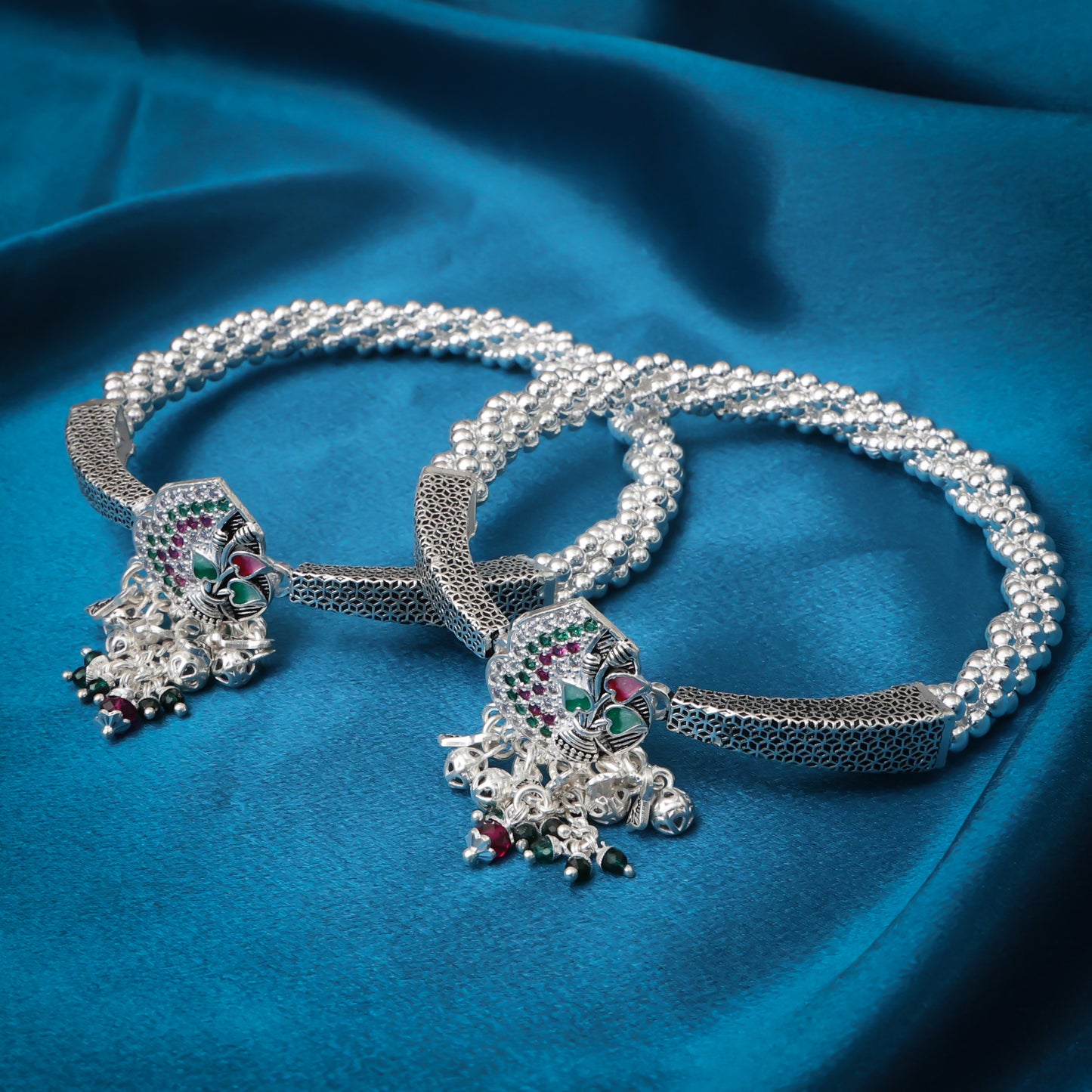 Charming silver kada payal with ghungroos, adding a festive and traditional touch.