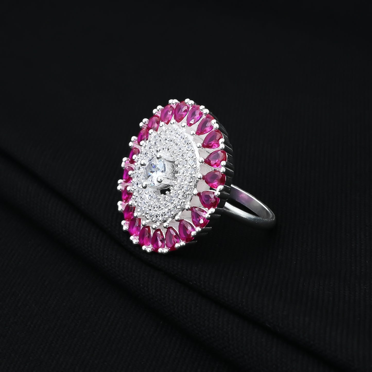 Purple gemstone-bordered silver ring