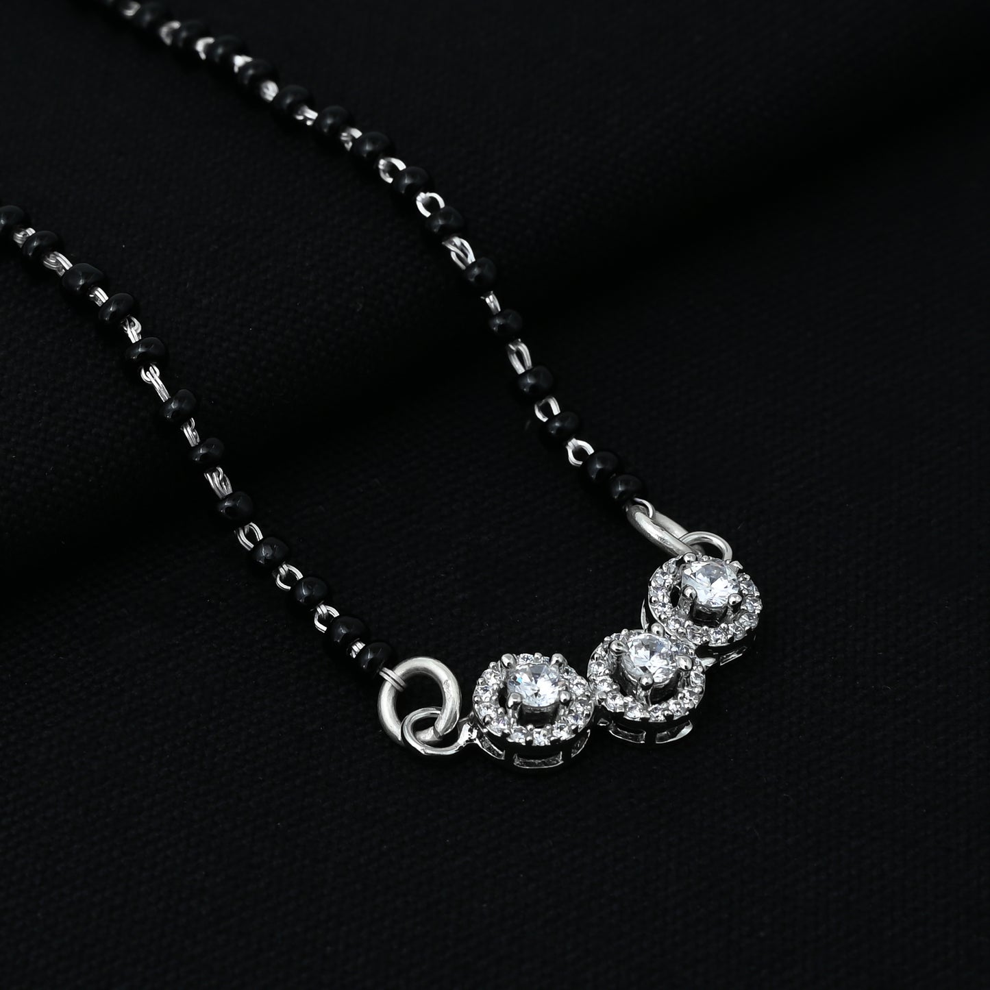 Timeless silver mangalsutra for girls, adorned with a central CZ stone and three elegant circular motifs