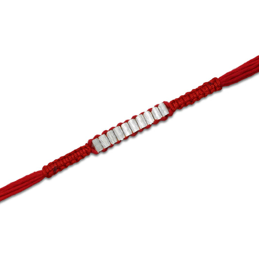 Boys' Rakhi featuring multiple silver cylinder-shaped beads for a unique design.