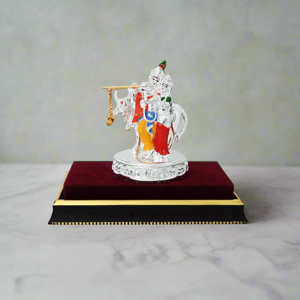 Elegant silver-plated RadhaKrishna idol with wax finish, symbolizing divine love and harmony.