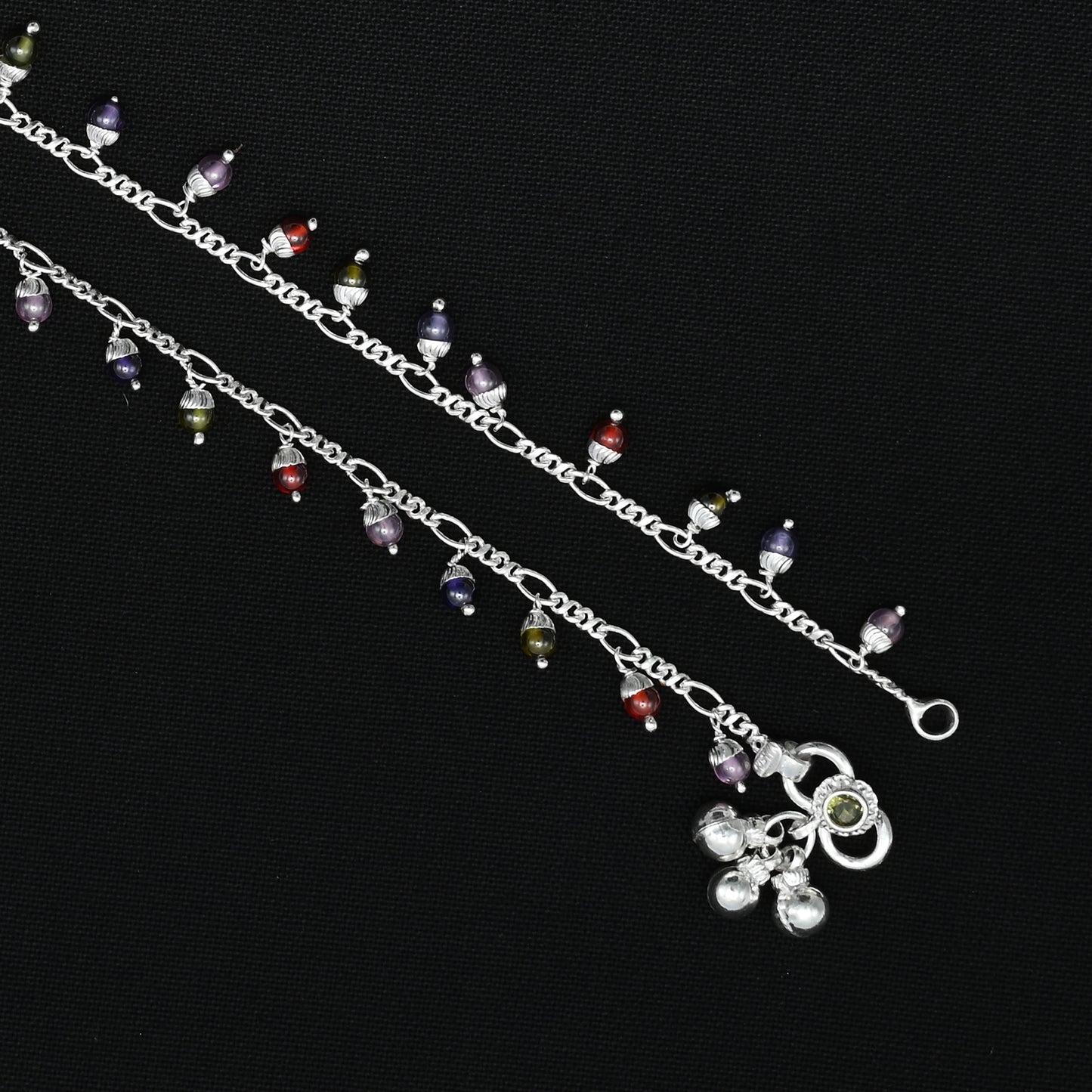 Beautiful silver payal with colorful gems set in a chain design, ideal for a lively and fashionable appearance