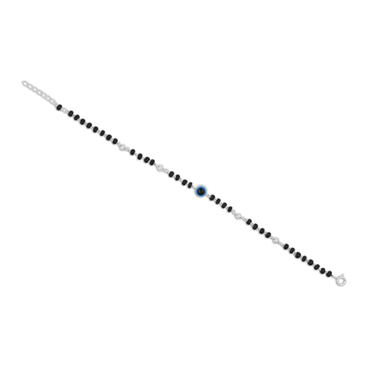 Charming silver bracelet with a blue evil eye design, complemented by black and silver beads for a stylish look