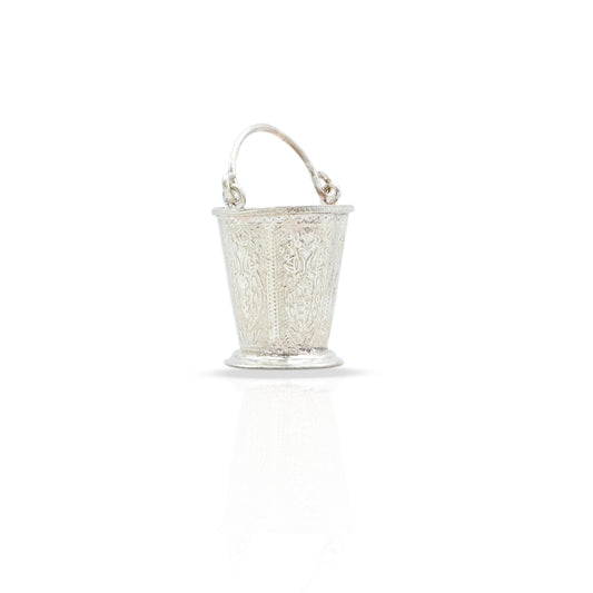 Close-up of the intricately designed silver bucket, ideal for both decor and rituals.