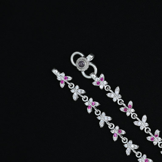 Charming silver anklet showcasing a pink gemstone butterfly design for a whimsical and graceful look