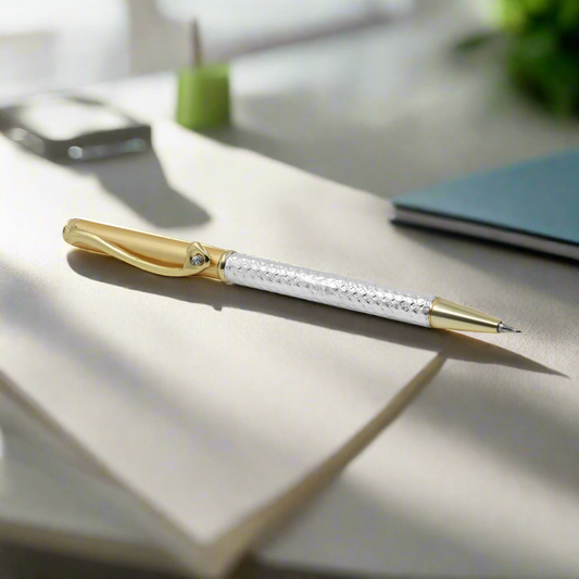 Silver pen with gold polish and an elegant heart design