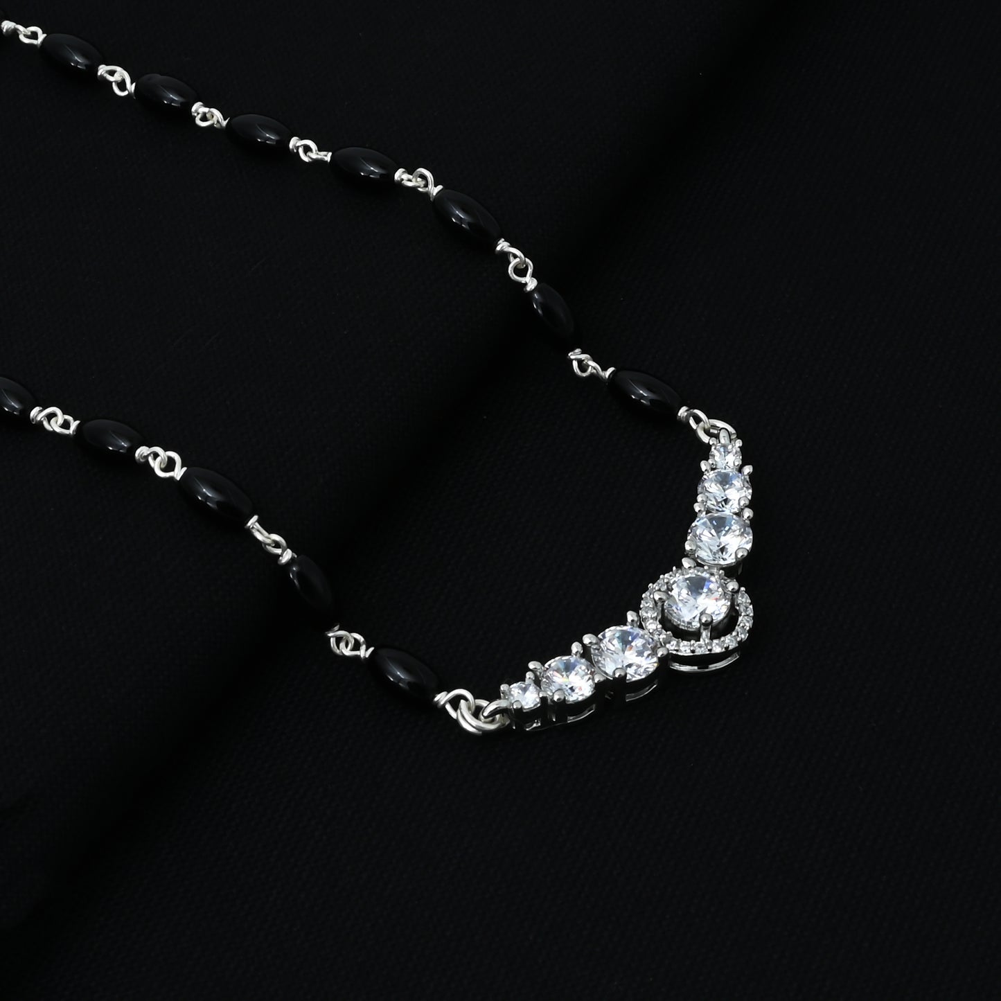Timeless silver mangalsutra adorned with a sparkling CZ gemstone for added elegance