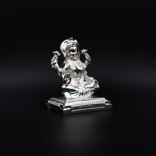 Handcrafted silver statue of Goddess Lakshmi, symbolizing wealth and prosperity.