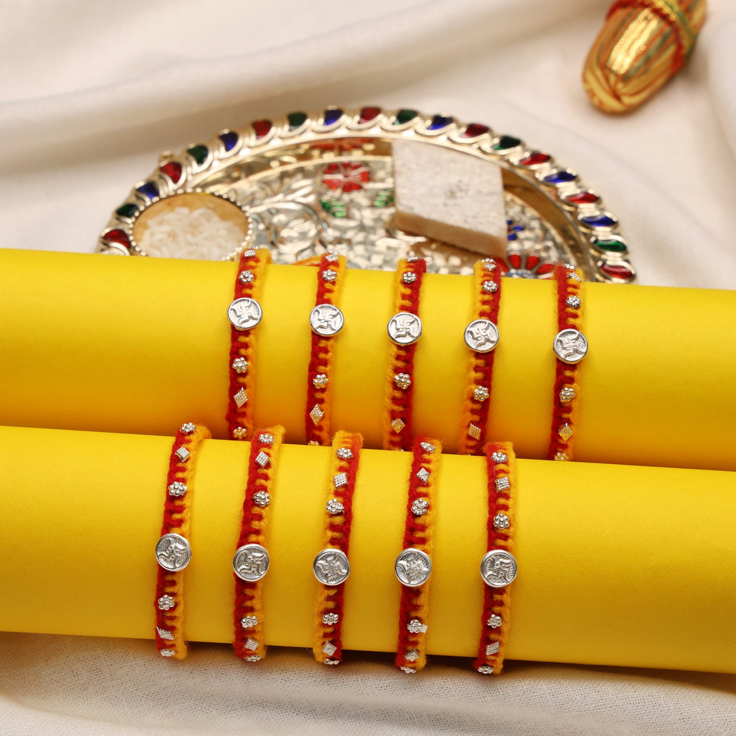 Swastik Charm Rakhi in Silver