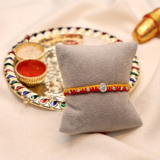 Swastik Charm Rakhi in Silver