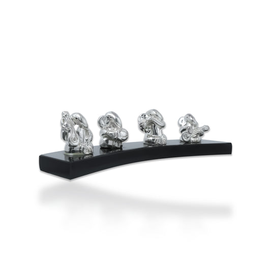 Handcrafted 999 silver Lord Ganesha statue with musical instrument, ideal for home decor and spiritual worship.