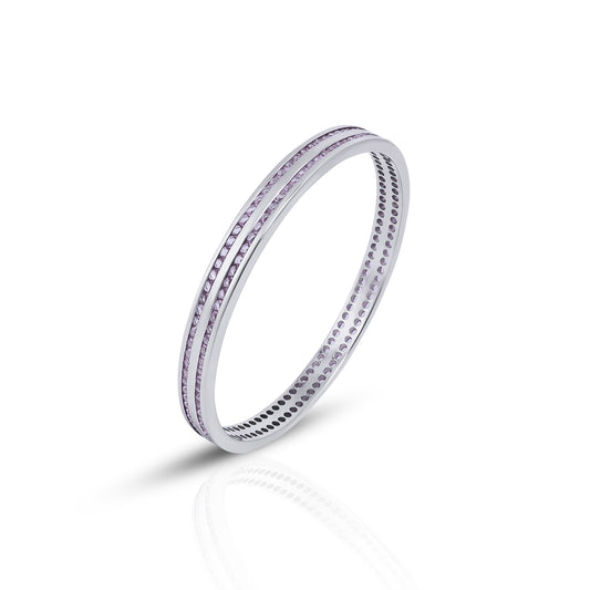 Elegant silver bangles featuring a design with light pink stone accents