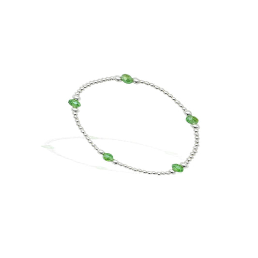 Stylish silver bracelet for girls adorned with eye-catching green beads