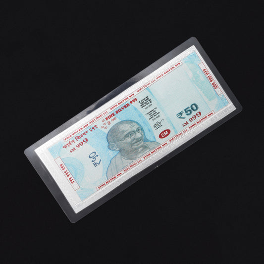 Close-up of the 999 silver laminated 50 Rupees note, designed for Lakshmi Poojan ceremonies.