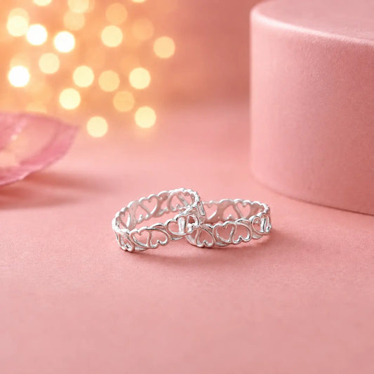 925 sterling silver adjustable heart design toe rings pair on soft pink background with luxury jewelry photography